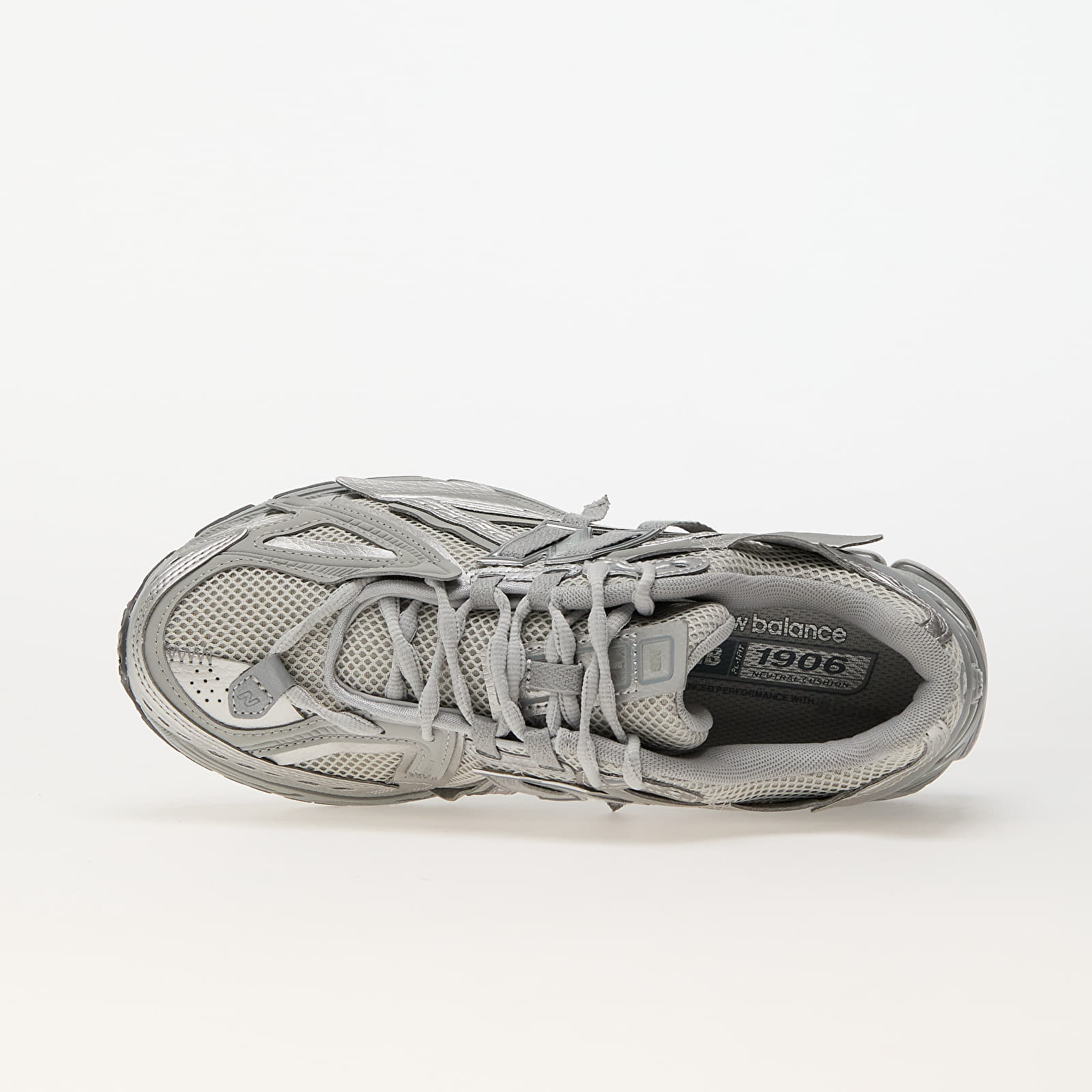1906A New Balance Grey metalic 2025 (lacets offet)
