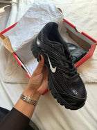 Nike running noire dans sa boîte